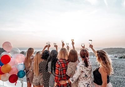 eight-female-friends-rise-their-hands-up-to-sky-ho-2023-11-27-05-35-49-utc